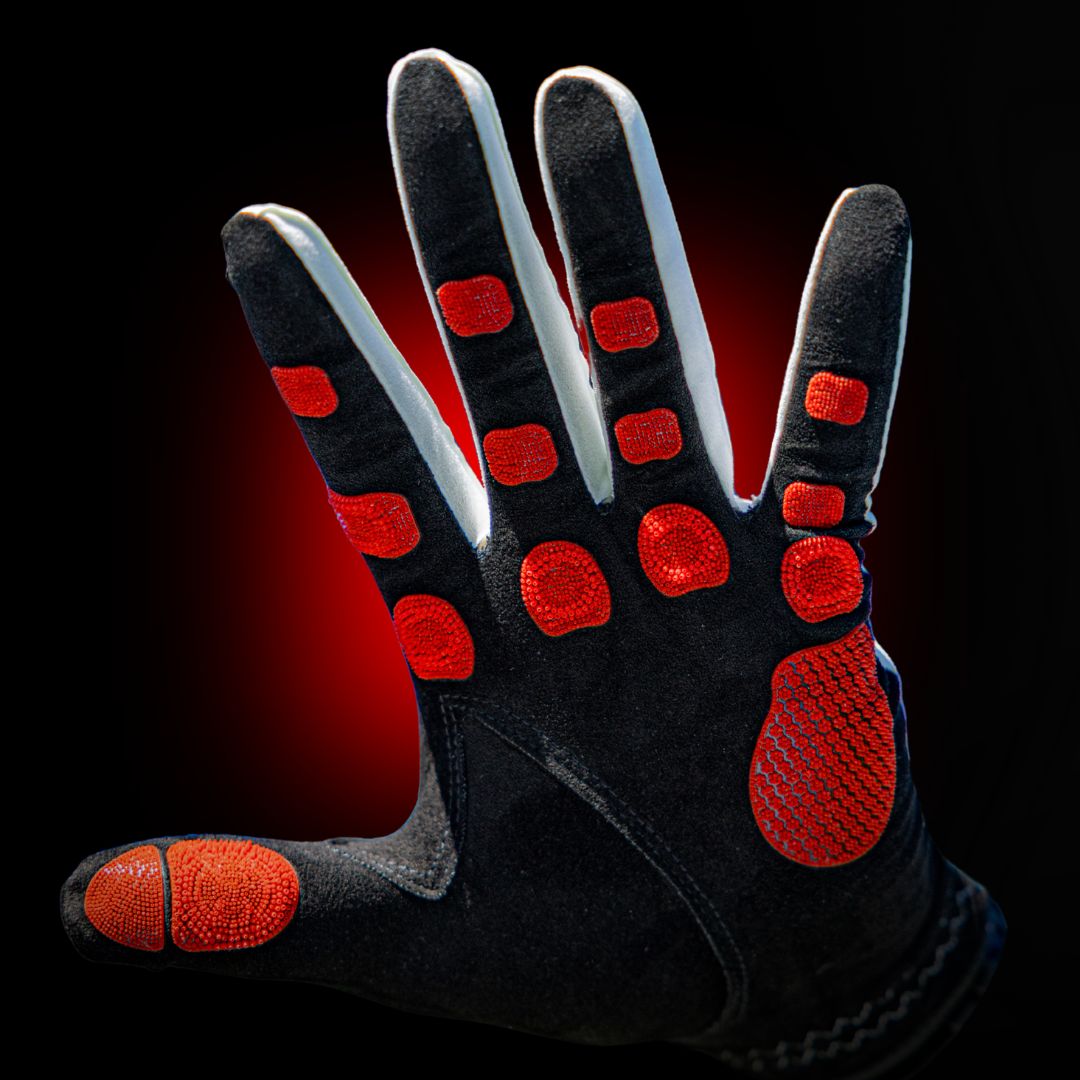 EXO Golf Glove palm view showing red Zyntech nanocell grip pads mapped across fingers and palm on black background